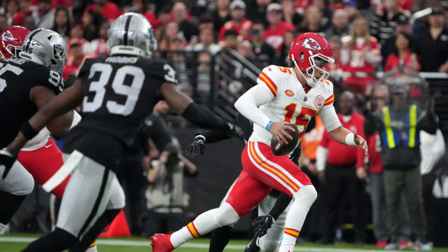 Nov 26, 2023; Paradise, Nevada, USA; Kansas City Chiefs quarterback Patrick Mahomes (15) carries the ball against the Las Vegas Raiders in the first half at Allegiant Stadium. Mandatory Credit: Kirby Lee-USA TODAY Sports  